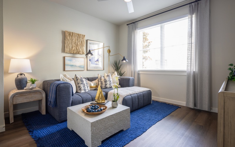 living room at broadstone baybrook apartments in webster