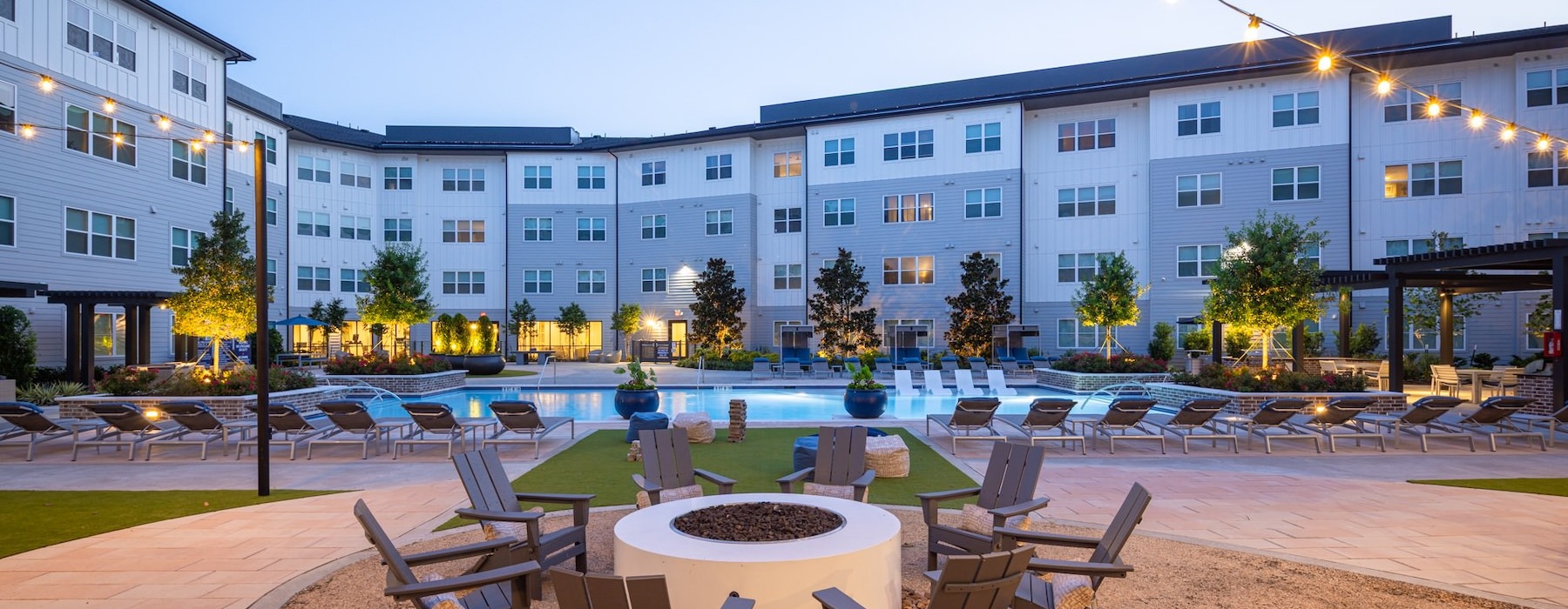 fire pit with pool in the background